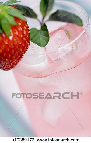 Herb tea with strawberry garnish View Large Photo Image Stock Image - Herb tea with strawberry garnish. Fotosearch