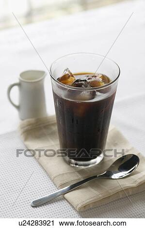 Iced coffee with spoon and creamer View Large Photo Image Stock Image - Iced coffee with spoon and creamer. Fotosearch