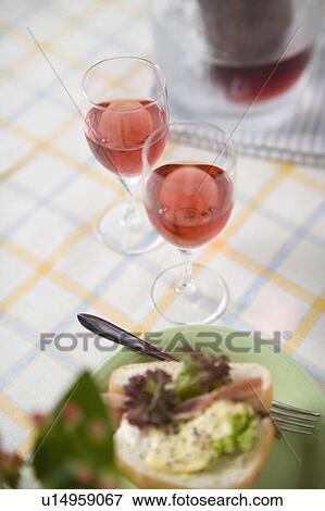 Two glasses of red wine and bread View Large Photo Image Stock Photo - Two glasses of red wine and bread. Fotosearch