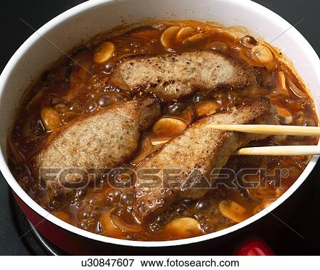 Stock Photo - Boiled pork with ketchup. Fotosearch