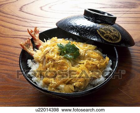 Bowl of rice topped with tempura and egg soup View Large Photo Image Stock Photo - Bowl of rice topped with tempura and egg soup. Fotosearch