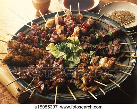 Stock Photo - Grilled chicken on skewers. Fotosearch