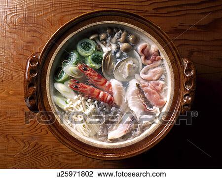 Stock Image - Stew cooked at the table. Fotosearch