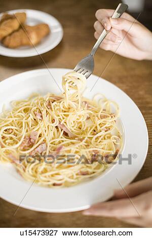 Eating spaghetti View Large Photo Image Stock Photo - Eating spaghetti. Fotosearch