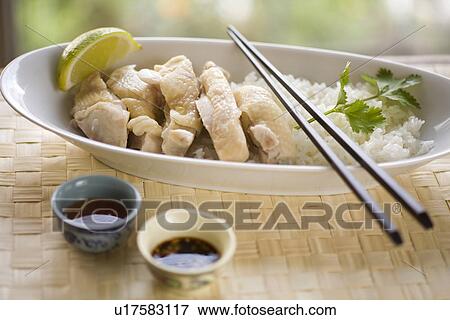 Hainanese chicken rice View Large Photo Image Stock Photo - Hainanese chicken rice. Fotosearch