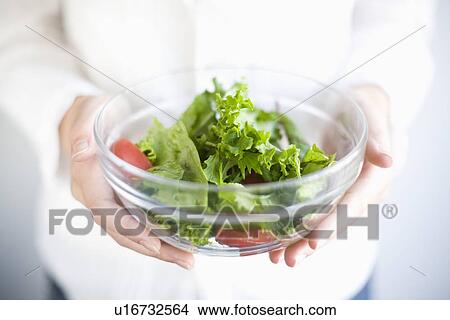 Holding salad bowl View Large Photo Image Picture - Holding salad bowl. Fotosearch