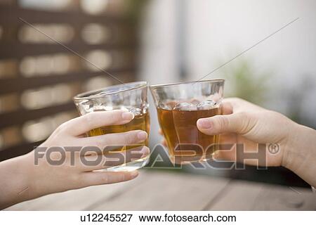 Stock Photo - Toasting hands. Fotosearch