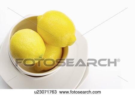 Stock Image - Lemons in bowl. Fotosearch