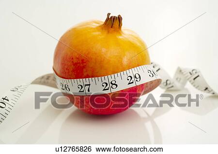 Pomegranate and Tape Measure View Large Photo Image Stock Photograph - Pomegranate and Tape Measure. Fotosearch