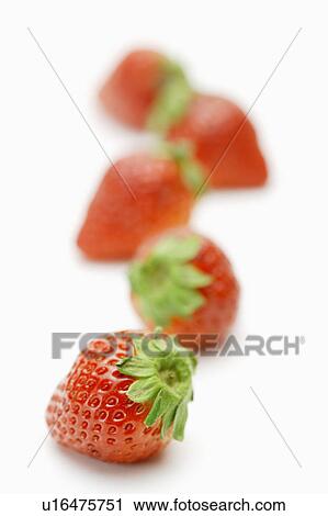 Stock Image - Strawberries in a row. Fotosearch