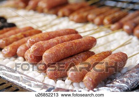 Stock Image - Sausage stuffed with Flying Fish Roe. Fotosearch