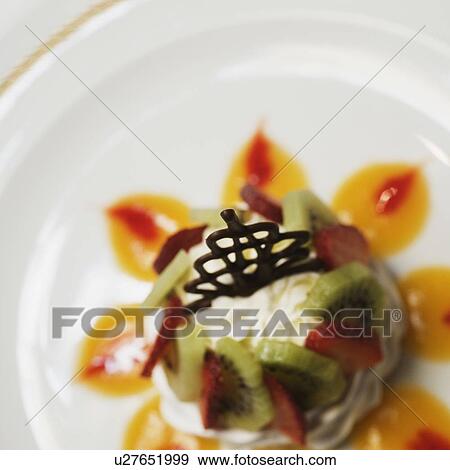 Close-up of a decorated dessert in a plate View Large Photo Image Stock Photo - Close-up of a decorated dessert in a plate. Fotosearch