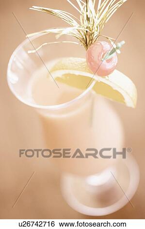 Stock Photograph - Close-up of a glass of cocktail. Fotosearch