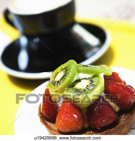 Stock Photograph - Close-up of a strawberry tart on a plate. Fotosearch