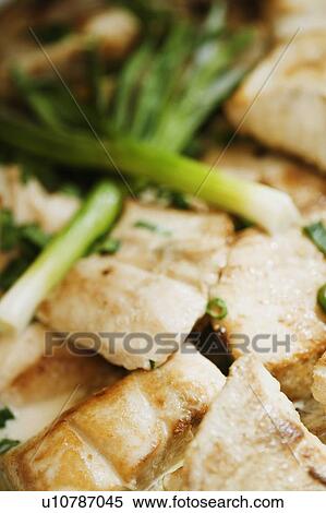Stock Photography - Close-up of chicken and leek. Fotosearch