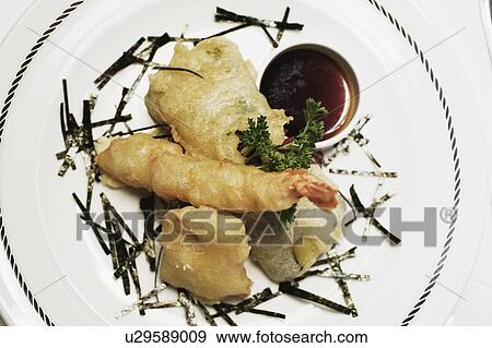 Close-up of seafood with a ketchup in a plate View Large Photo Image Stock Photo - Close-up of seafood with a ketchup in a plate. Fotosearch