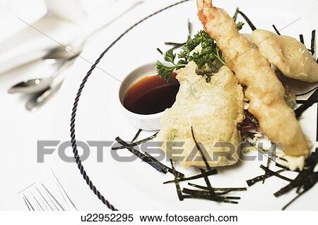 Close-up of seafood with a ketchup in a plate View Large Photo Image Stock Photography - Close-up of seafood with a ketchup in a plate. Fotosearch