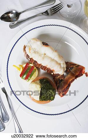 Stock Image - High angle view of a lobster dish on a plate. Fotosearch