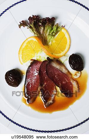 Stock Photography - High angle view of bacon with gravy on a plate. Fotosearch