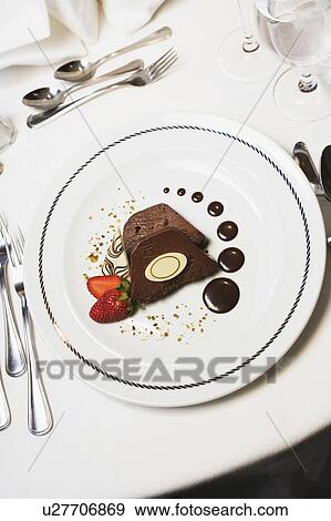 High angle view of two chocolate pieces with strawberries in a plate View Large Photo Image Stock Photo - High angle view of two chocolate pieces with strawberries in a plate. Fotosearch