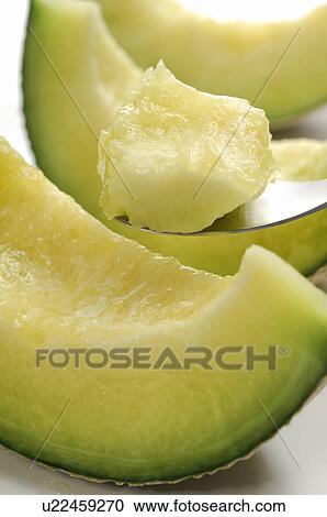 Stock Image - Cut Muskmelon. Fotosearch