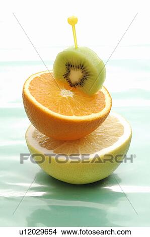 Half Cut of Kiwi Fruit, Orange and Grapefruit View Large Photo Image Picture - Half Cut of Kiwi Fruit, Orange and Grapefruit. Fotosearch