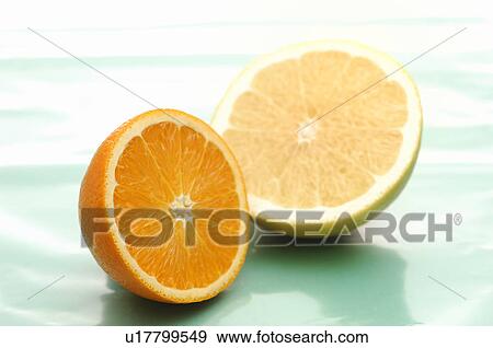 Half Cut of Orange and Grapefruit View Large Photo Image Stock Photo - Half Cut of Orange and Grapefruit. Fotosearch