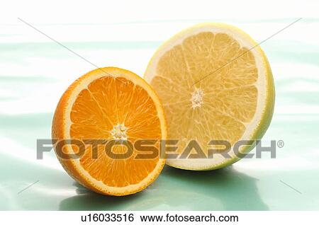 Half Cut of Orange and Grapefruit View Large Photo Image Stock Photograph - Half Cut of Orange and Grapefruit. Fotosearch