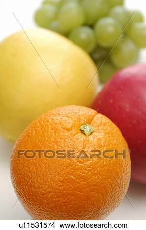 Orange, Apple, Grapefruit and Grape View Large Photo Image Picture - Orange, Apple, Grapefruit and Grape. Fotosearch