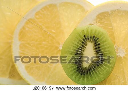 Stock Photo - Sliced Kiwi Fruit and Grapefruit. Fotosearch