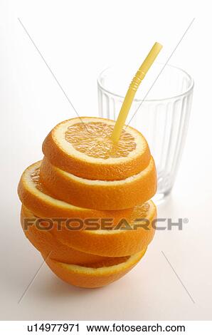 Stock Image - Sliced Orange with Straw. Fotosearch