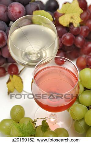 Two glasses of wine and grape View Large Photo Image Stock Image - Two glasses of wine and grape. Fotosearch
