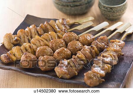 Stock Image - Grilled Skewered Chicken. Fotosearch