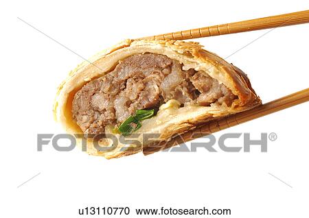 Close-up of a meat stuffed dumpling in chopsticks View Large Photo Image Stock Image - Close-up of a meat stuffed dumpling in chopsticks. Fotosearch
