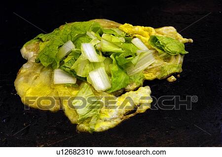 Stock Image - Close-up of an oyster omelet. Fotosearch