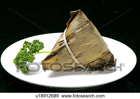 Close-up of bamboo leaf wrapped Zongzi View Large Photo Image Stock Photo - Close-up of bamboo leaf wrapped Zongzi. Fotosearch