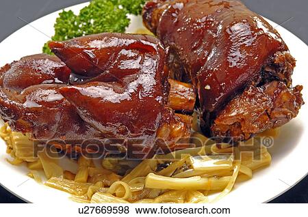Stock Photo - Close-up of Oriental pork trotters with bamboo shoot. Fotosearch