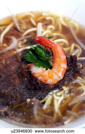 Stock Image - Close-up of prawn and noodle soup. Fotosearch