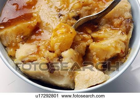 Stock Image - High angle view of bowl rice cake. Fotosearch