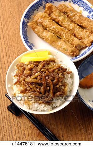 Stock Image - High angle view of braised pork rice. Fotosearch