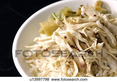 Stock Photo - High angle view of Oriental shredded chicken and rice. Fotosearch