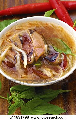High angle view of Oriental squid and noodle soup View Large Photo Image Stock Photo - High angle view of Oriental squid and noodle soup. Fotosearch