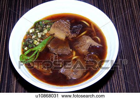 Stock Image - High angle view of Oriental tripe and mushroom soup. Fotosearch