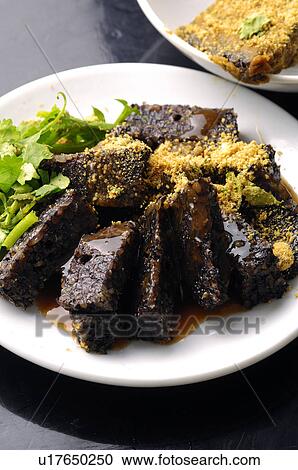 Stock Image - High angle view of pig blood cake. Fotosearch