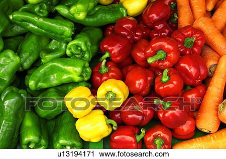 Stock Image - Close-up of bell peppers with radish. Fotosearch