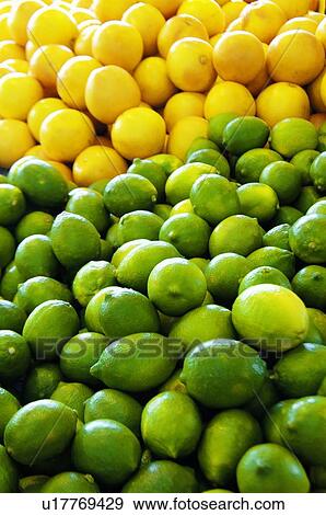 Stock Photo - Heap of green and yellow lemons. Fotosearch