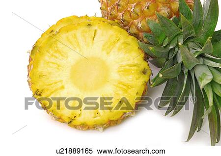 Stock Photography - Close-up of a pineapple with slices. Fotosearch