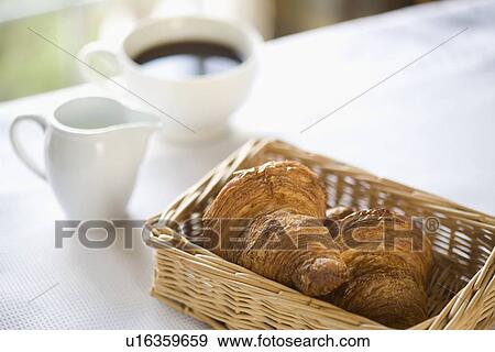 Croissant and coffee View Large Photo Image Stock Photo - Croissant and coffee. Fotosearch