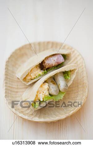 Stock Photo - Egg and sausage in pita bread. Fotosearch