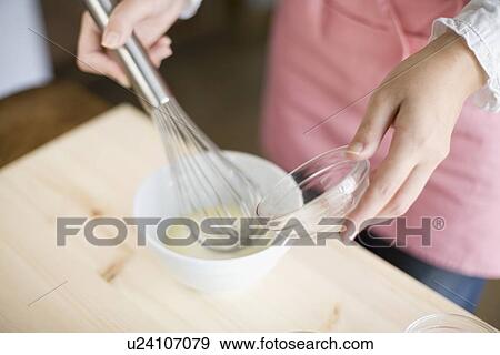 Human hand of young woman cooking bread View Large Photo Image Stock Photo - Human hand of young woman cooking bread. Fotosearch